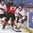 BUFFALO, NEW YORK - JANUARY 2: Switzerland's Philipp Kurashev #23 plays the puck while Canada's Robert Thomas #27 pins him to the board during quarterfinal round action at the 2018 IIHF World Junior Championship. (Photo by Matt Zambonin/HHOF-IIHF Images)


